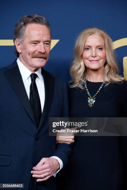 Bryan Cranston and Anna Gunn pose in the press room during the 30th Annual Screen Actors Guild Awards at Shrine Auditorium and Expo Hall on February...