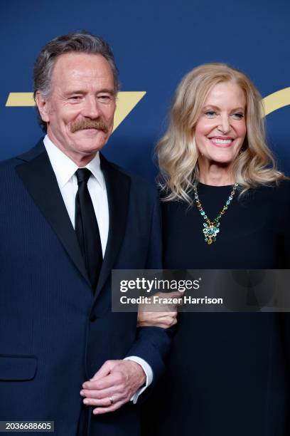 Bryan Cranston and Anna Gunn pose in the press room during the 30th Annual Screen Actors Guild Awards at Shrine Auditorium and Expo Hall on February...