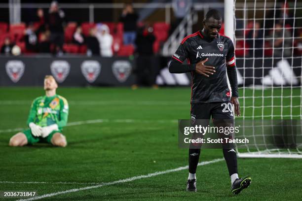 Christian Benteke of D.C. United reacts after scoring his third goal of the MLS game against Henrich Ravas of New England Revolution during the...
