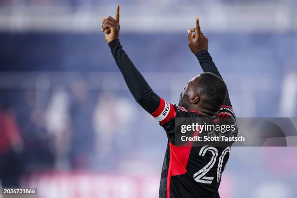 Christian Benteke of D.C. United celebrates after scoring his second goal of the MLS game against the New England Revolution during the second half...