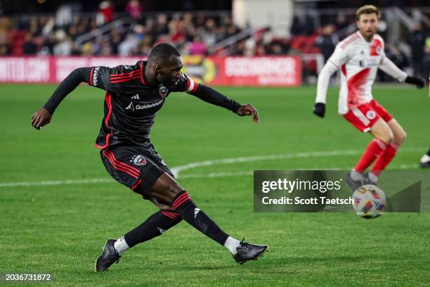 Christian Benteke of D.C. United kicks the ball against the New England Revolution during the second half of the MLS game at Audi Field on February...