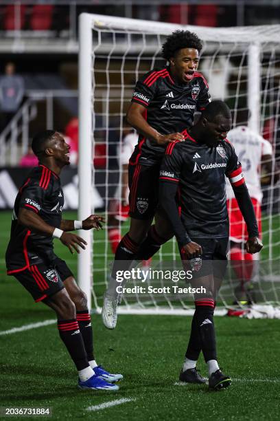Christian Benteke of D.C. United celebrates with Kristian Fletcher and Cristian Dájome after scoring his third goal of the MLS game against the New...