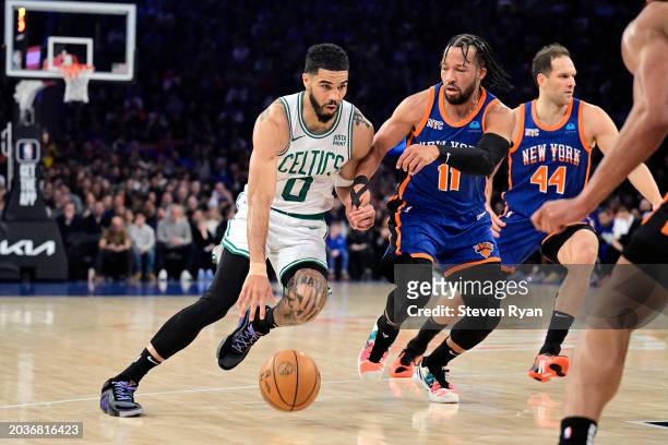 Jayson Tatum of the Boston Celtics is defended by Jalen Brunson of the New York Knicks during the first half at Madison Square Garden on February 24,...
