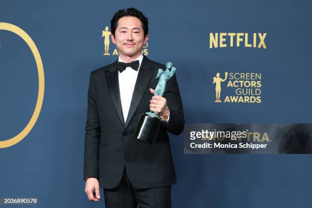 Steven Yeun, winner of the Outstanding Male Actor in a Television Movie or Limited Series award for 'Beef' poses in the press room during the 30th...