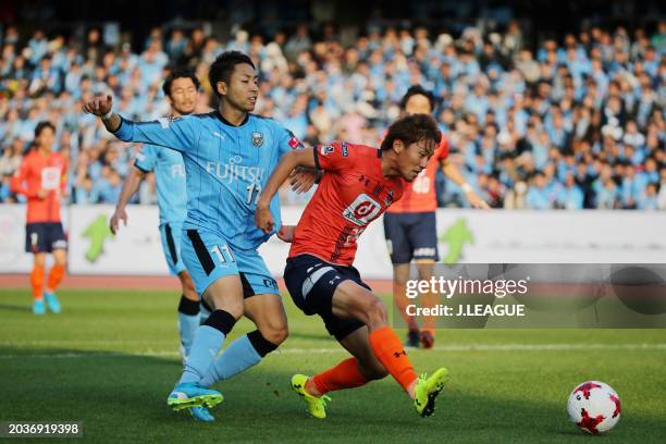 Kazuma Takayama of Omiya Ardija controls the ball against Yu Kobayashi of Kawasaki Frontale during the J.League J1 match between Kawasaki Frontale...