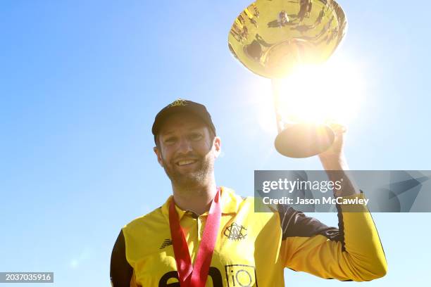 Andrew Tye of Western Australia celebrates with the trophy during the March One Day Cup Final match between New South Wales Blues and Western...