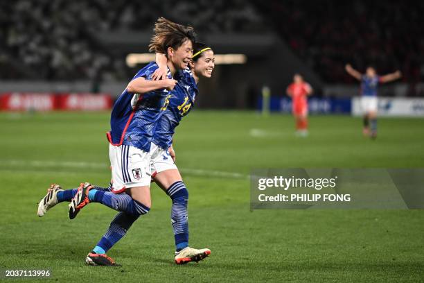 Japan's Aoba Fujino celebrates with teammate Japan's Yui Hasegawa after scoring their team's second goal in the second half during the 2024 Olympic...