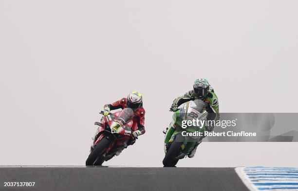 Alex Lowes of Great Britain and Kawasaki Racing Team passes Alvaro Bautista of Spain and Aruba.it – Ducati on the final lap during race two of the...