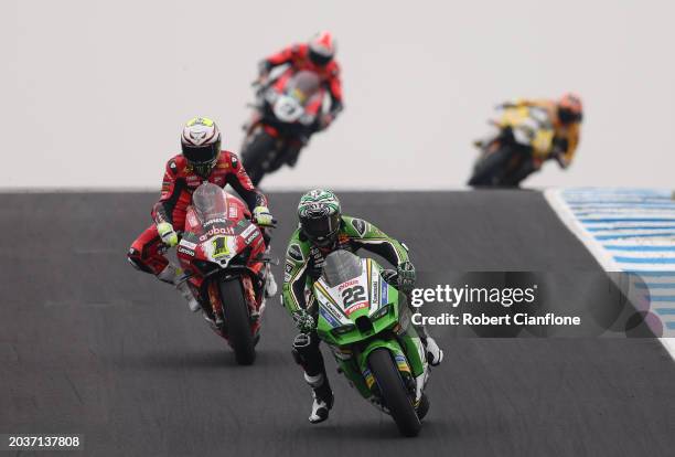 Alex Lowes of Great Britain and Kawasaki Racing Team passes Alvaro Bautista of Spain and Aruba.it – Ducati on the final lap during race two of the...