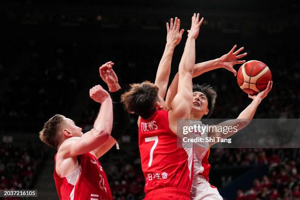 Mingxuan Hu of China drives against Kai Toews of Japan during the FIBA Asia Cup qualifier Group C game between Japan and China at Ariake Coliseum on...