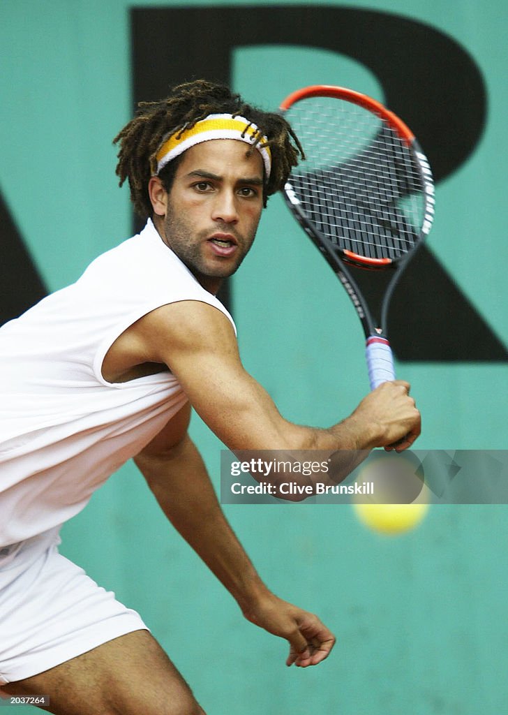 James Blake of the USA returns serve