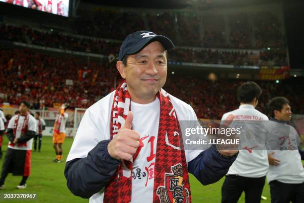 Head coach Yahiro Kazama of Nagoya Grampus celebrates the team's promotion to the J1 following the scoreless draw in the J.League J1 Promotion...