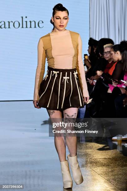 Model wears a tennis-skirt inspired chocolate brown and tan striped skirt with bow detail and w two-tone long-sleeve top in beige and taupe by...