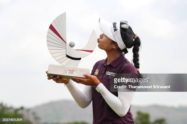 Patty Tavatanakit of Thailand poses with The Honda LPGA Thailand trophy after victory in the final round of the Honda LPGA Thailand at Siam Country...
