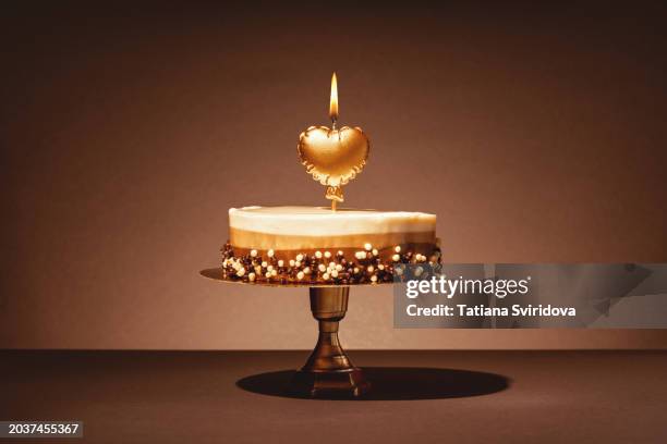 birthday chocolate mousse cake with burning candle - multi layer cake stock pictures, royalty-free photos & images