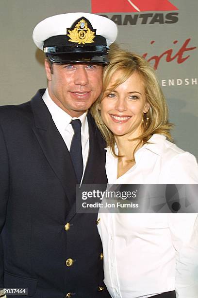 Actor John Travolta poses with wife Kelly Preston after arriving in their Quantas 707 "Jett Clipper Ella" on the final stop of his round the globe...