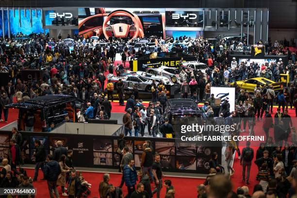 Visitors are during the first public day of the Geneva International Motor Show in Geneva, on February 28, 2024.