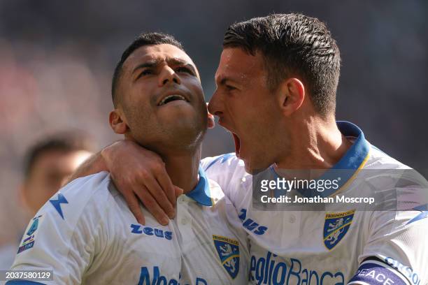 Walid Cheddira of Frosinone Calcio celebrates with team mate Luca Mazzitelli after scoring to level the game at 1-1 during the Serie A TIM match...