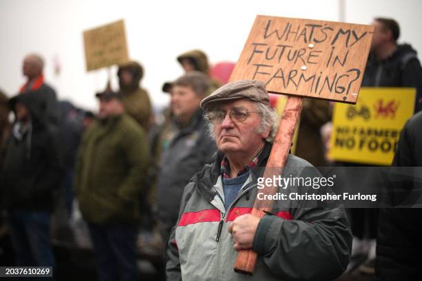 Protester holds a placard reading "What's my future in farming?" outside the Senedd on February 28, 2024 in Cardiff, Wales. Following peaceful...