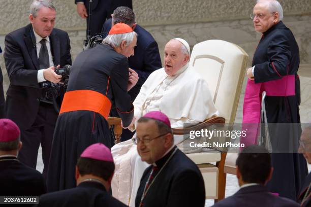 Pope Francis is greeting Matteo Zuppi at the end of his weekly general audience in Paul VI Hall, Vatican, on February 28, 2024.