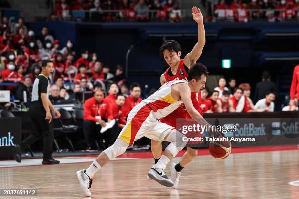 Jiwei Zhao of China drives to the basket against Yuki Kawamura of Japan during the FIBA Basketball Asia Cup qualifier Group C game between Japan and...