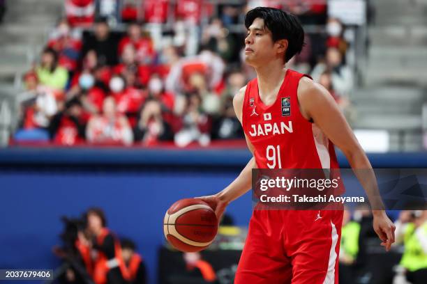 Hirotaka Yoshii of Japan dribbles the ball during the FIBA Basketball Asia Cup qualifier Group C game between Japan and China at Ariake Coliseum on...