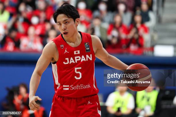 Yuki Kawamura of Japan dribbles the ball during the FIBA Basketball Asia Cup qualifier Group C game between Japan and China at Ariake Coliseum on...