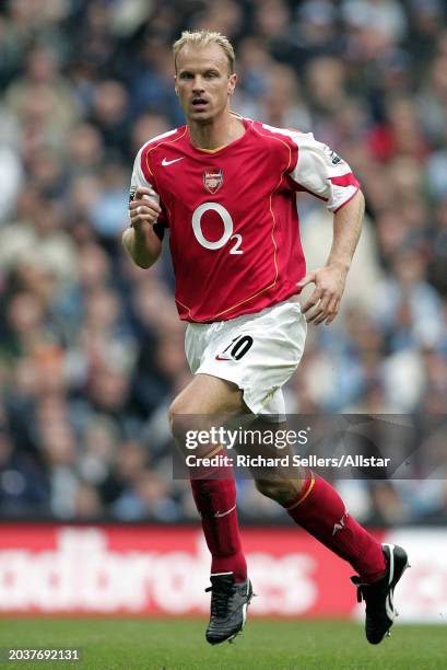 Dennis Bergkamp of Arsenal running during the Premier League match between Manchester City and Arsenal at City Of Manchester Stadium on September 25,...