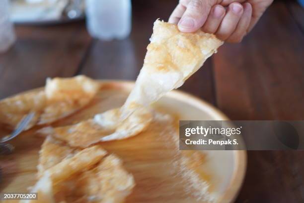 Soenes Roti 279 Thai Roti Stock Photos, High-Res Pictures, and Images - Getty Images