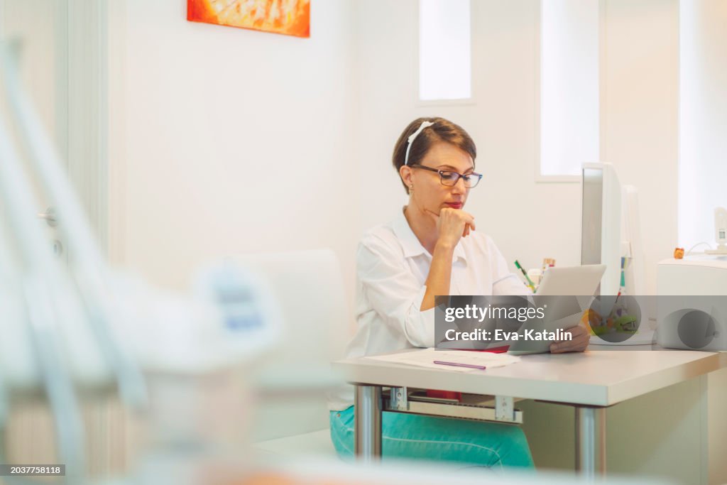 Doctor working in her office