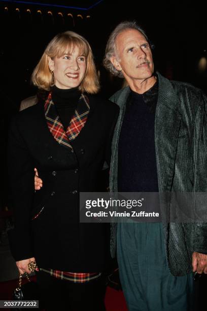 American actress Laura Dern, wearing a black jacket with tartan lapels, and her father, American actor Bruce Dern, who wears a grey jacket over a...