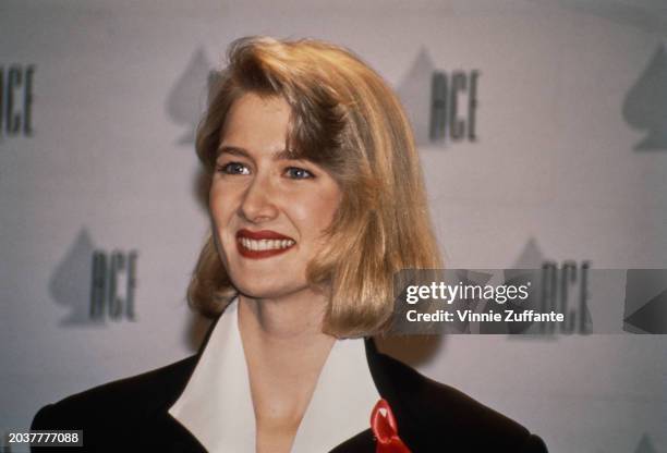 American actress Laura Dern, wearing a white wide-collar shirt beneath a black jacket, attends the 13th Annual CableACE Awards, held at the Pantages...