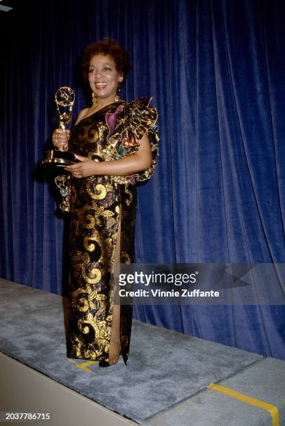 American actress Ruby Dee, wearing a gold-and-black asymmetric evening gown, in the press room of the 43rd Primetime Emmy Awards, held at the...