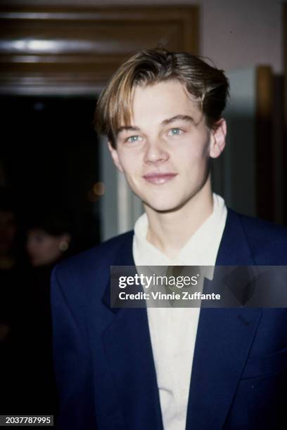 American actor Leonardo DiCaprio, wearing a dark blue suit jacket over a white shirt, attends the 19th Annual Los Angeles Film Critics Association...