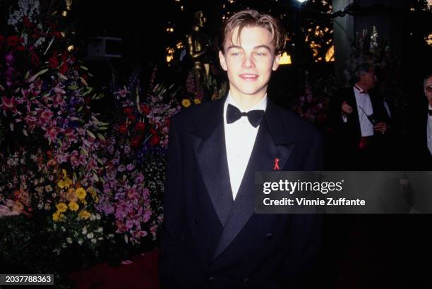 American actor Leonardo DiCaprio, wearing a tuxedo and bow tie, attends the 66th Academy Awards, held at the Dorothy Chandler Pavilion in Los...