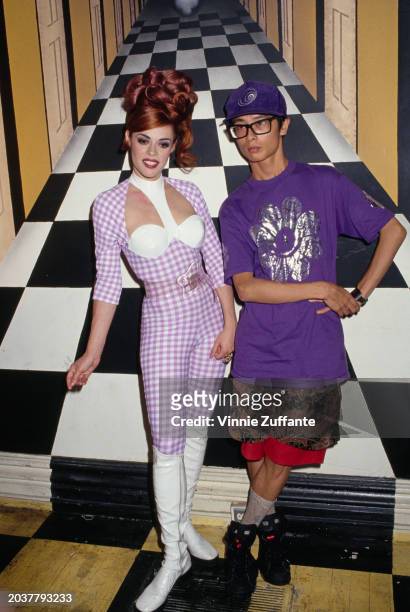 American singer, songwriter and DJ Lady Miss Kier, in a white-and-lilac checked outfit with a keyhole neckline and white knee-high boots, and...