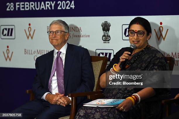 Bill Gates, co-chairman of the Bill and Melinda Gates Foundation, left, and Smriti Irani, India's women and child development minister, at an event...