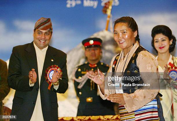 Nepalese Crown Prince Paras Bir Bikram Shah Dev applauds after giving an honor medal to Everest summiter Sherpa Pemba Doma during ceremonies...