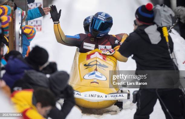 Francesco Friedrich and Alexander Schüller of Germany celebrate after their final round of the 2-man Bobsleigh competition at the BMW IBSF Bobsleigh...