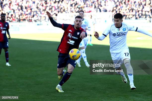 Gianluca Gaetano of Cagliari competes with Mathias Olivera of Napoli during the Serie A TIM match between Cagliari and SSC Napoli at Sardegna Arena...