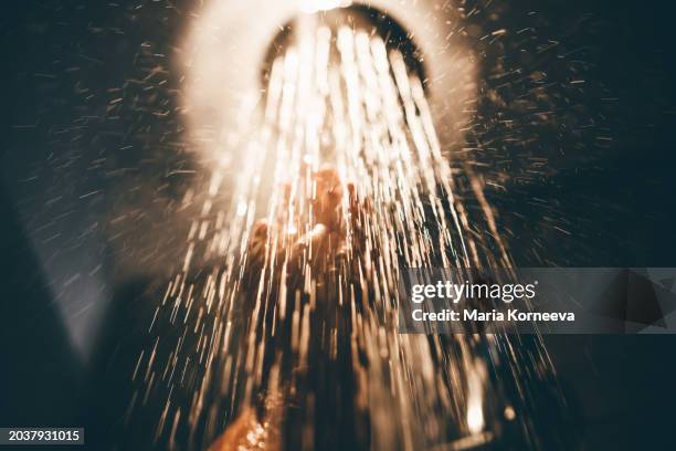 woman taking a shower at home. - woman using shower gel stock pictures, royalty-free photos & images