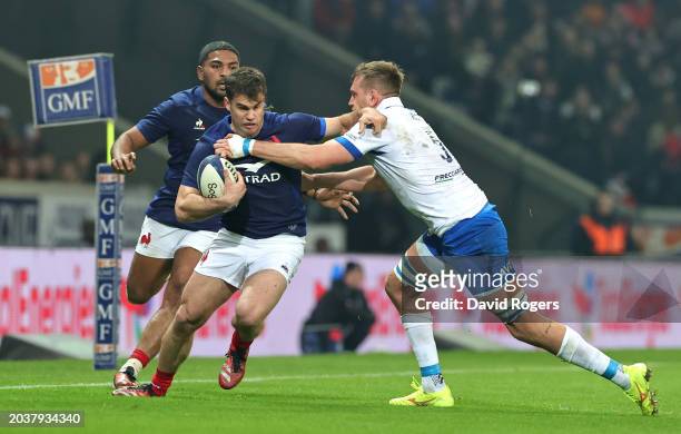 Damian Penaud of France is tackled by Federico Ruzza of Italy during the Guinness Six Nations 2024 match between France and Italy at Stade Pierre...