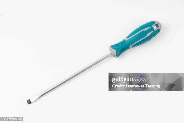 green flat head screwdriver isolated on white - schroevendraaier stockfoto's en -beelden
