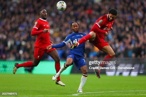 Raheem Sterling of Chelsea battles for possession with Joe Gomez and Ibrahima Konate of Liverpool during the Carabao Cup Final match between Chelsea...