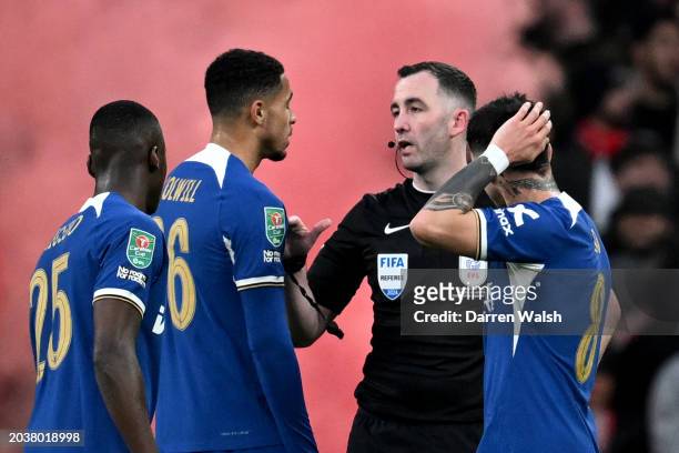 Referee Chris Kavanagh speaks with Levi Colwill of Chelsea after Virgil van Dijk of Liverpool scores a goal which is later disallowed by VAR for...