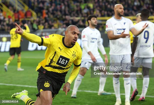 Donyell Malen of Borussia Dortmund celebrates scoring his team's first goal during the Bundesliga match between Borussia Dortmund and TSG Hoffenheim...