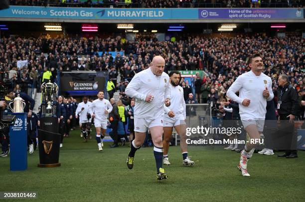 Dan Cole and George Furbank of England make their way onto the pitch for the national anthem during the Guinness Six Nations 2024 match between...
