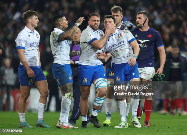 Paolo Garbisi of Italy is consoled by team mates after missing a last minute, match winning penalty during the Guinness Six Nations 2024 match...