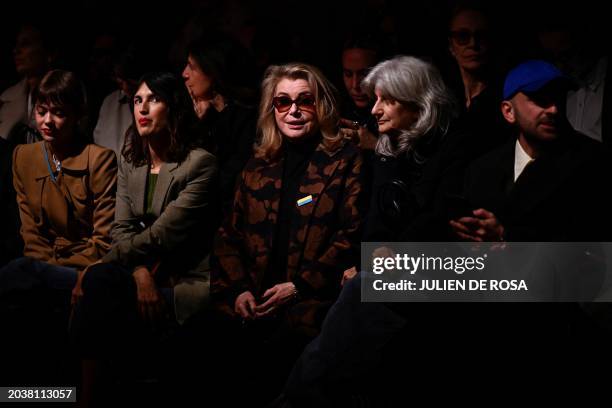 French designer, creative director, model and founder of French fashion label Rouje, Jeanne Damas and French actress Catherine Deneuve sit ahead of...