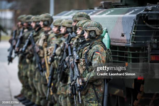 Soldiers stand in front of the Puma infantry fighting vehicle during a visit of German Defence Minister Boris Pistorius at the Bundeswehr...